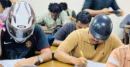 জবিতে হেলমেট পরে পরীক্ষা দিচ্ছেন শিক্ষার্থীরা